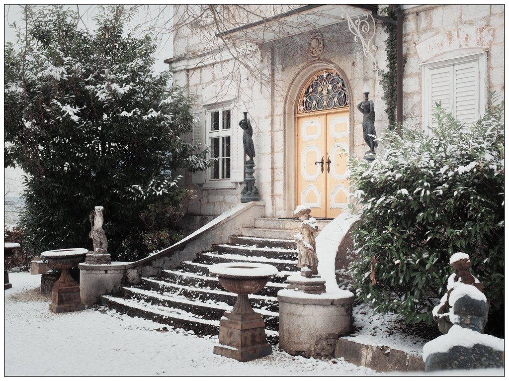 Snow-covered house entrance in winter